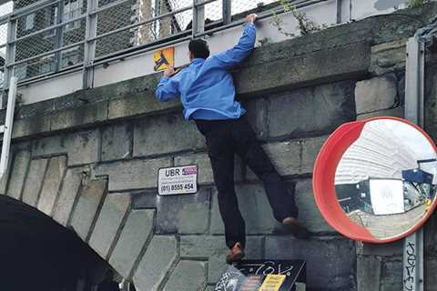 Graffiti Urban Artist Climbs To Place Art Outside Google Dublin